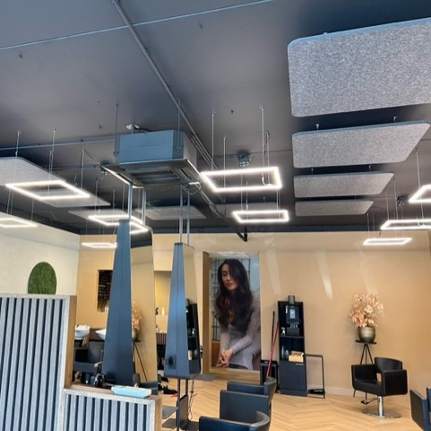 Square EASYfelt ceiling islands of PET felt applied in a hair salon